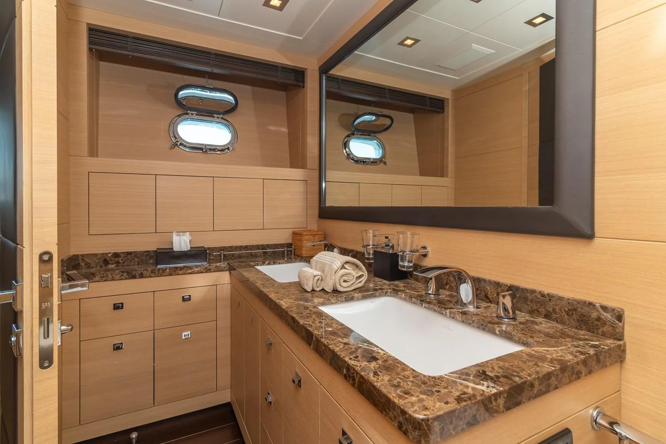 a bathroom with a large mirror aboard KAWAI Yacht for Sale