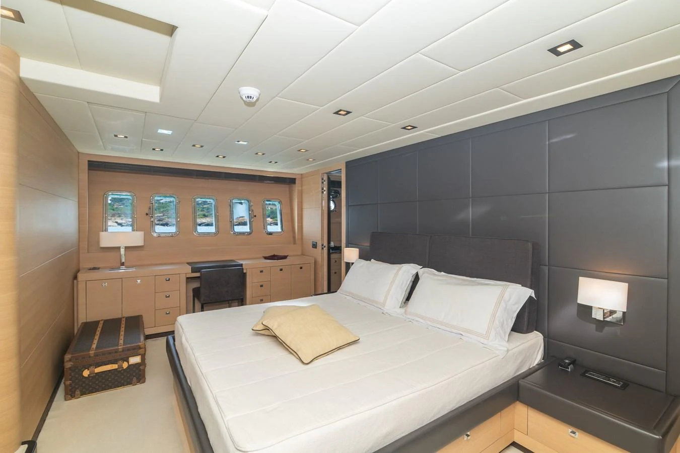 a room with a bed and a desk aboard KAWAI Yacht for Sale