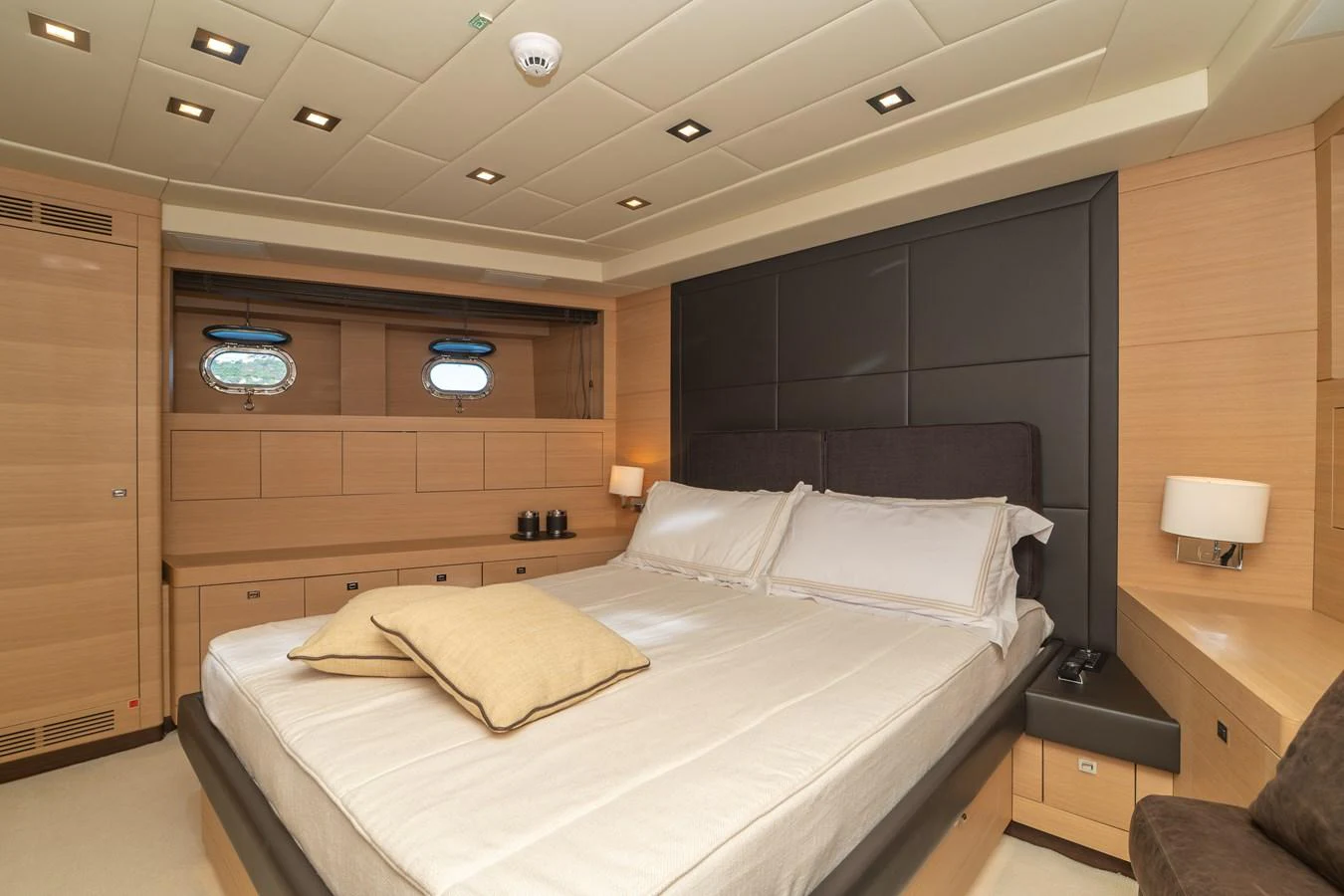 a room with a bed and a desk aboard KAWAI Yacht for Sale