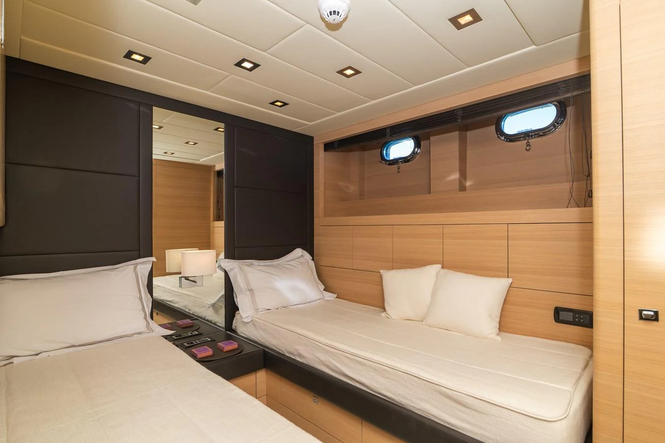 a room with two beds aboard KAWAI Yacht for Sale
