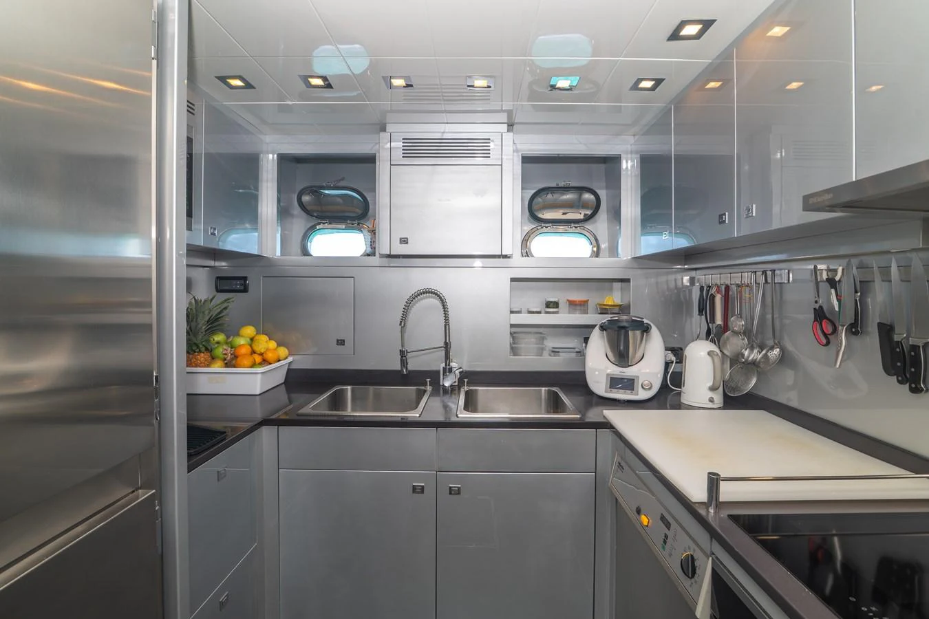 a kitchen with a sink and cabinets aboard KAWAI Yacht for Sale