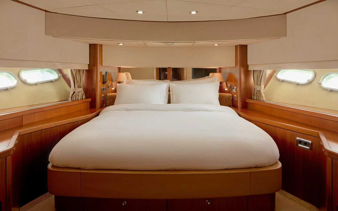 a large bed with white sheets aboard MAJOR AFFAIR Yacht for Sale