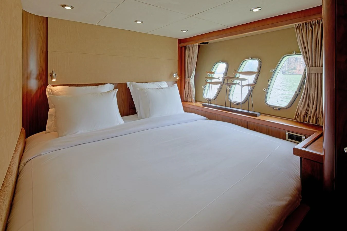a bed with white sheets aboard MAJOR AFFAIR Yacht for Sale
