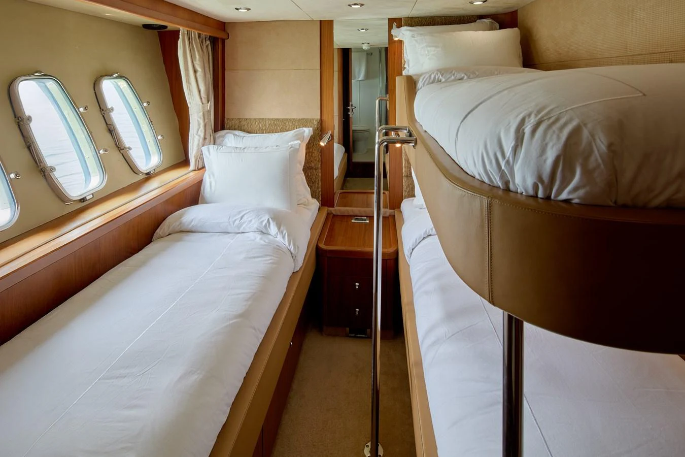 a room with a bed and a mirror aboard MAJOR AFFAIR Yacht for Sale