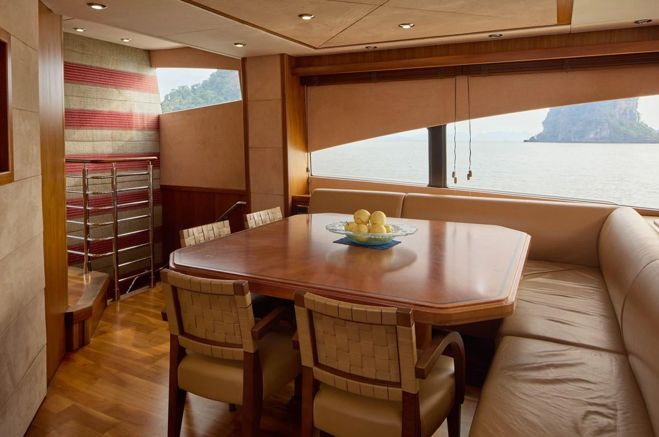 a table with chairs around it aboard MAJOR AFFAIR Yacht for Sale