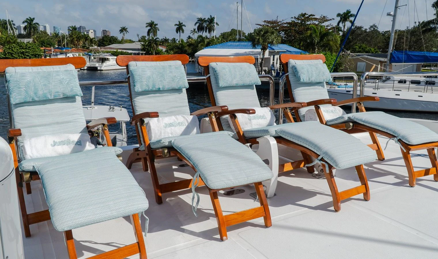 a group of chairs on a beach aboard JUSMAD Yacht for Sale
