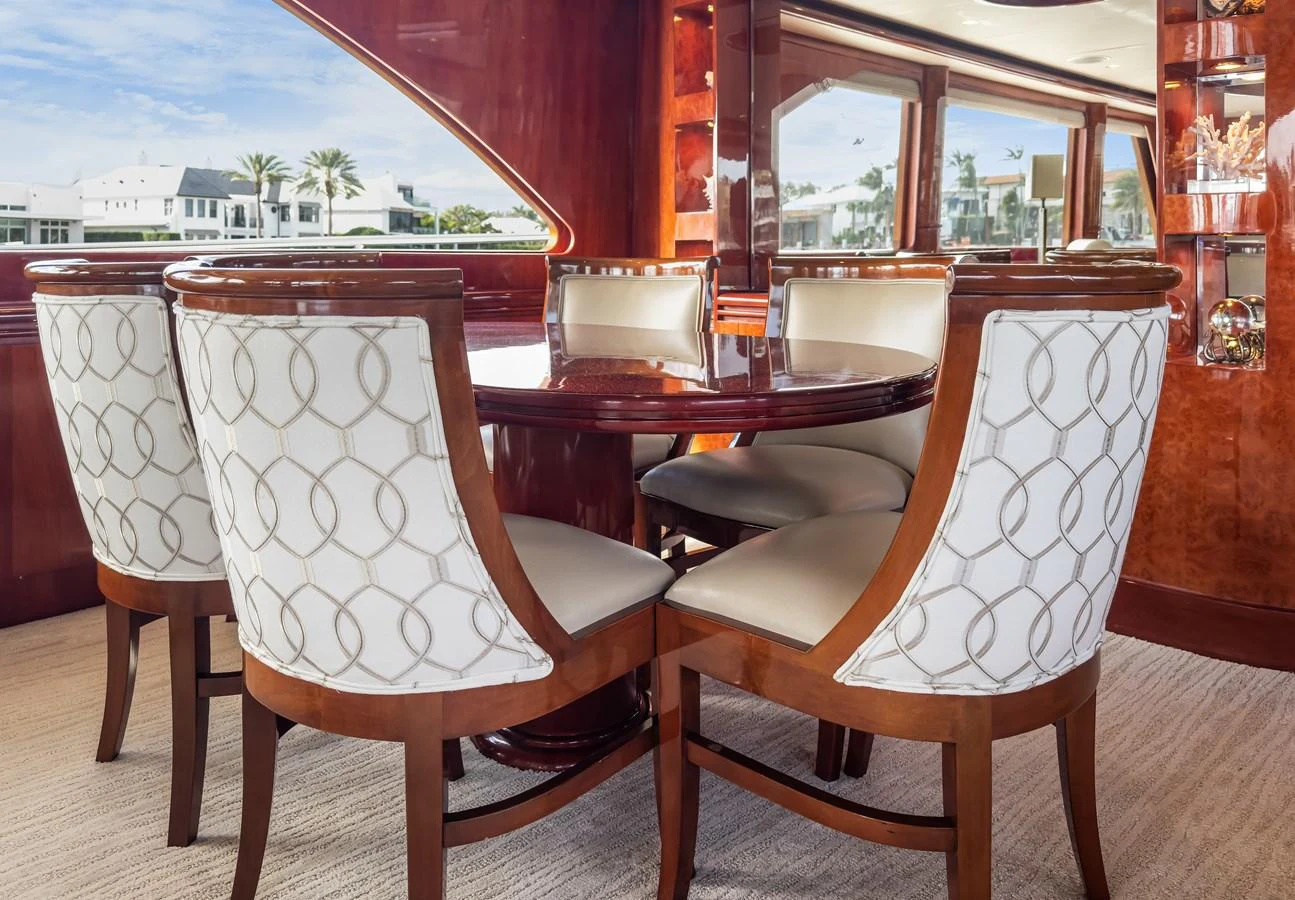 a group of chairs around a table aboard JUSMAD Yacht for Sale