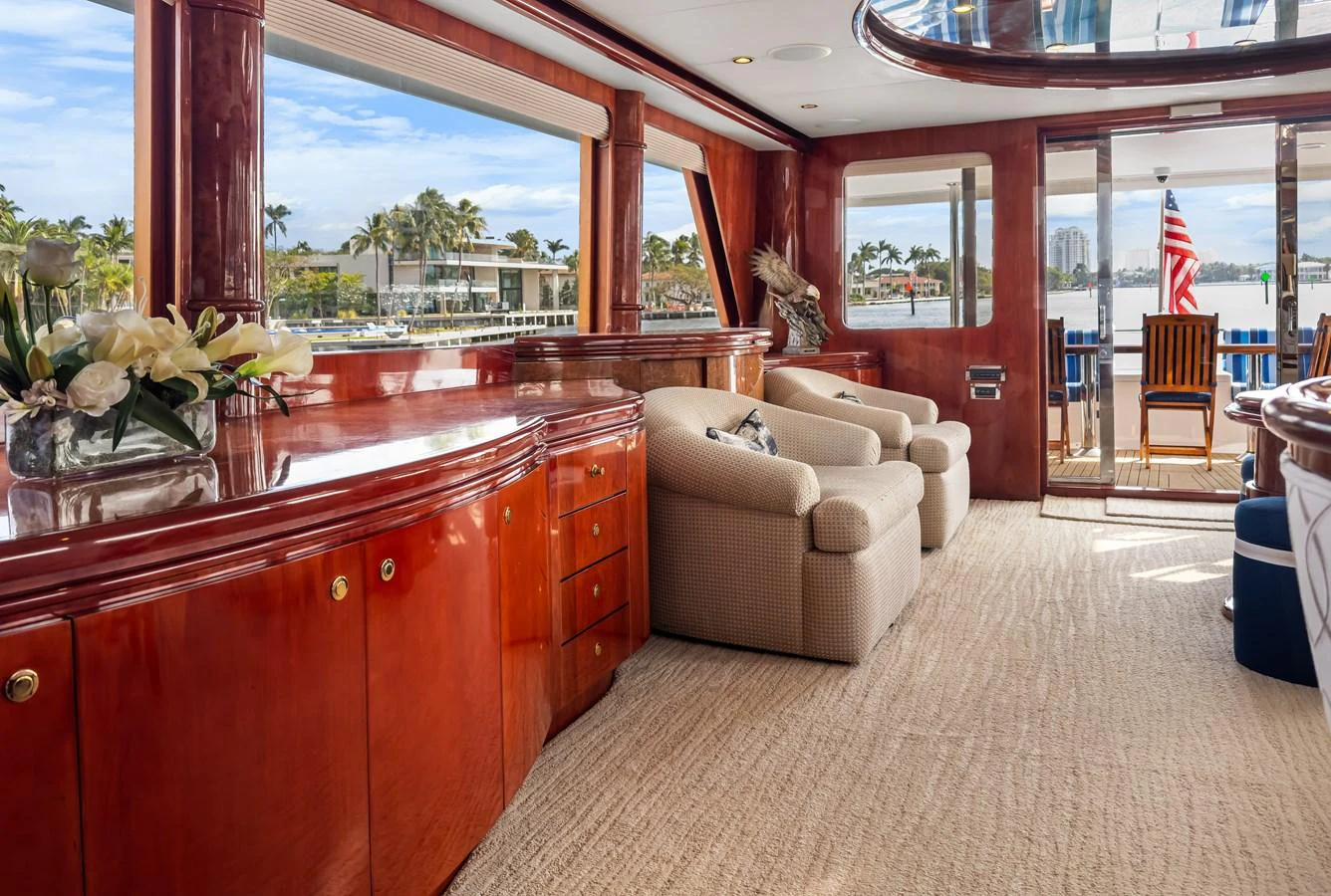 a living room with a large window aboard JUSMAD Yacht for Sale