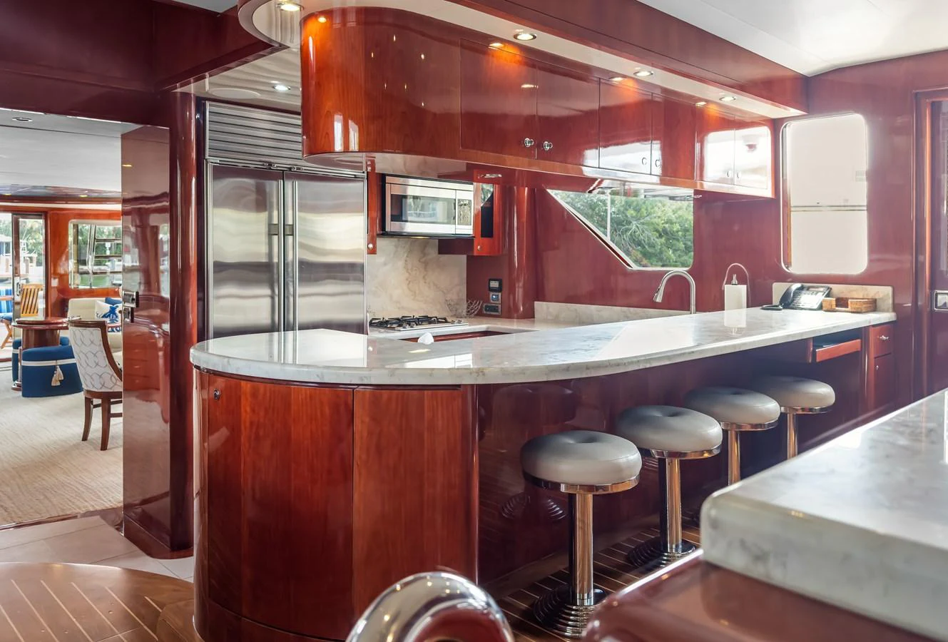 a kitchen with a bar and bar aboard JUSMAD Yacht for Sale