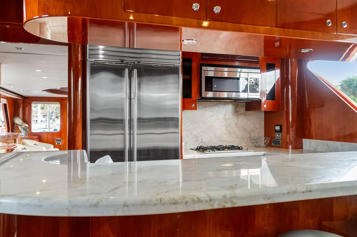 a kitchen with a stainless steel refrigerator aboard JUSMAD Yacht for Sale