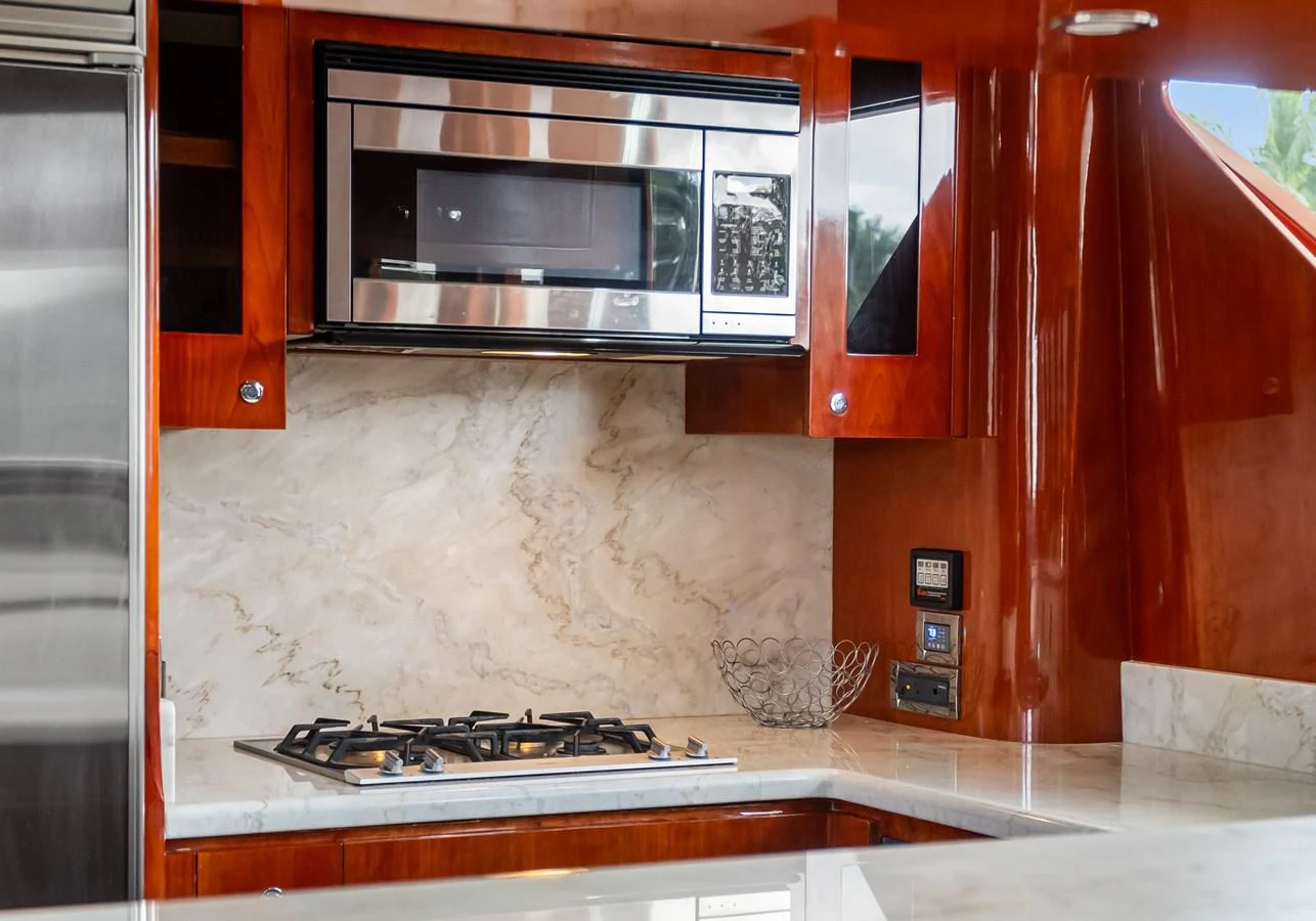 a kitchen with a microwave oven aboard JUSMAD Yacht for Sale