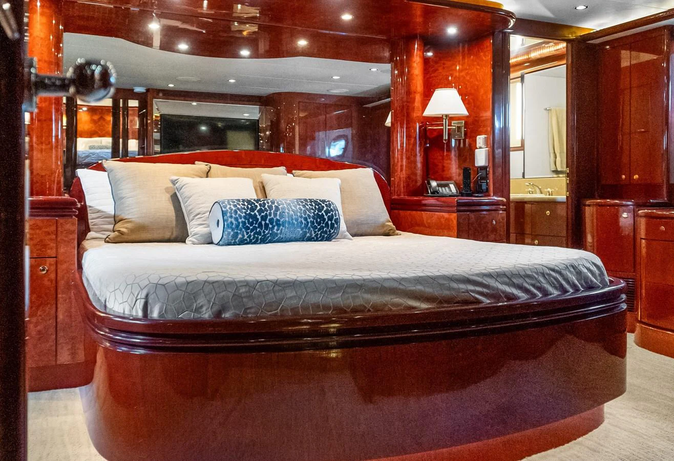 a bed with a large bed aboard JUSMAD Yacht for Sale