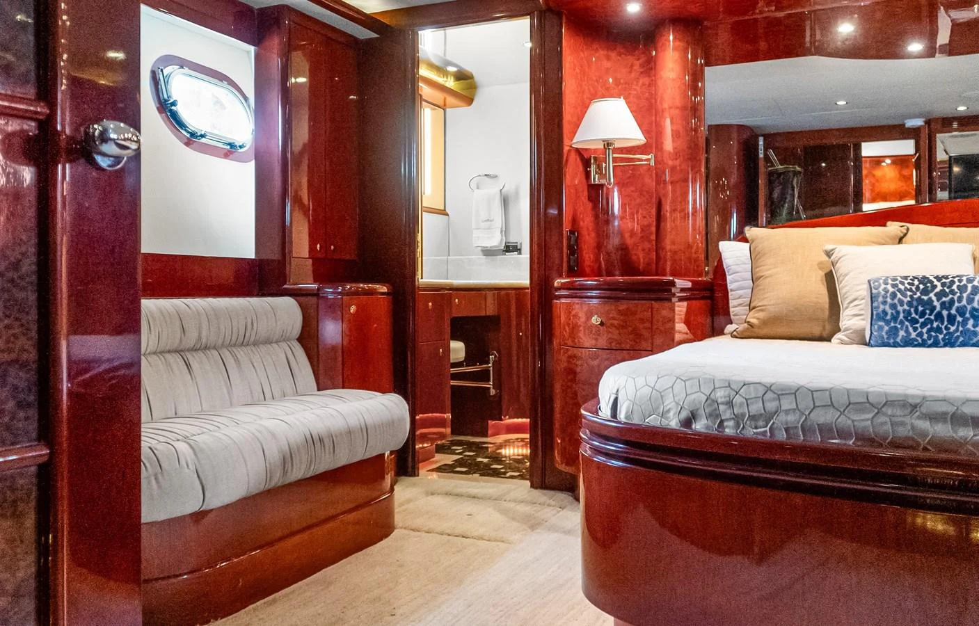 a room with a bed and a couch aboard JUSMAD Yacht for Sale