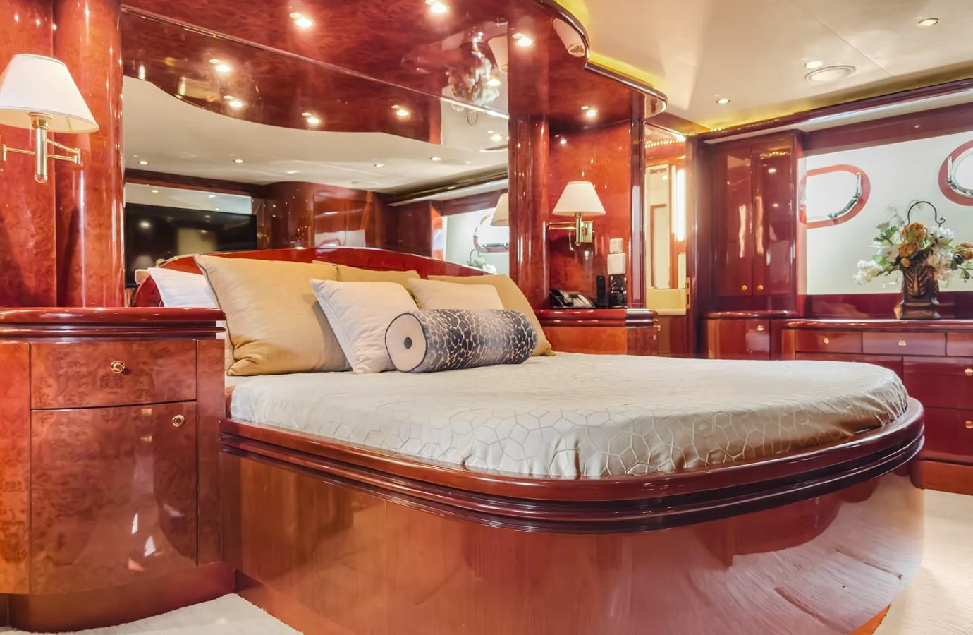 a large bed with a white comforter and pillows aboard JUSMAD Yacht for Sale