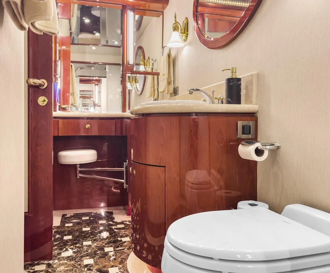 a bathroom with a toilet and a sink aboard JUSMAD Yacht for Sale