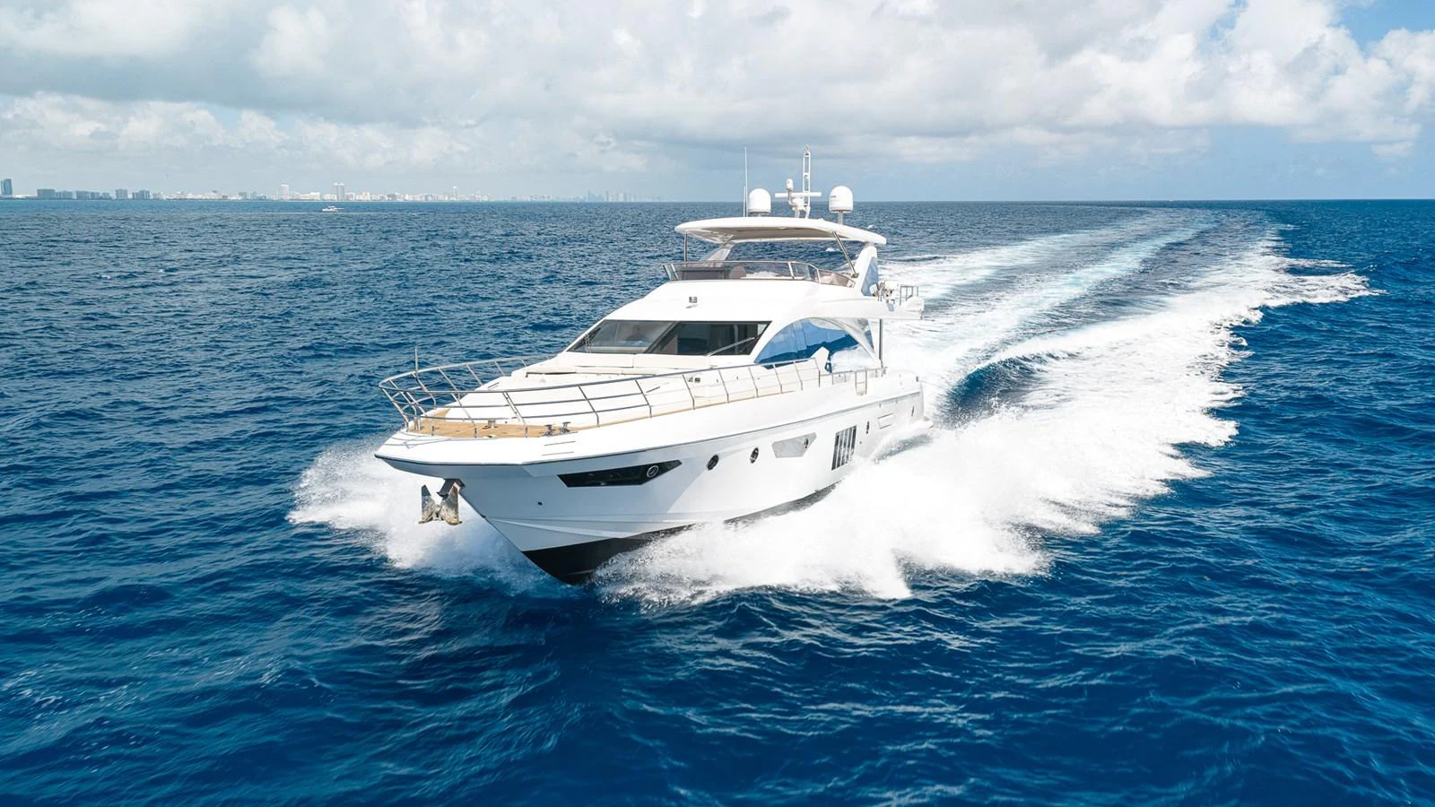 a white yacht in the water aboard SABI Yacht for Sale