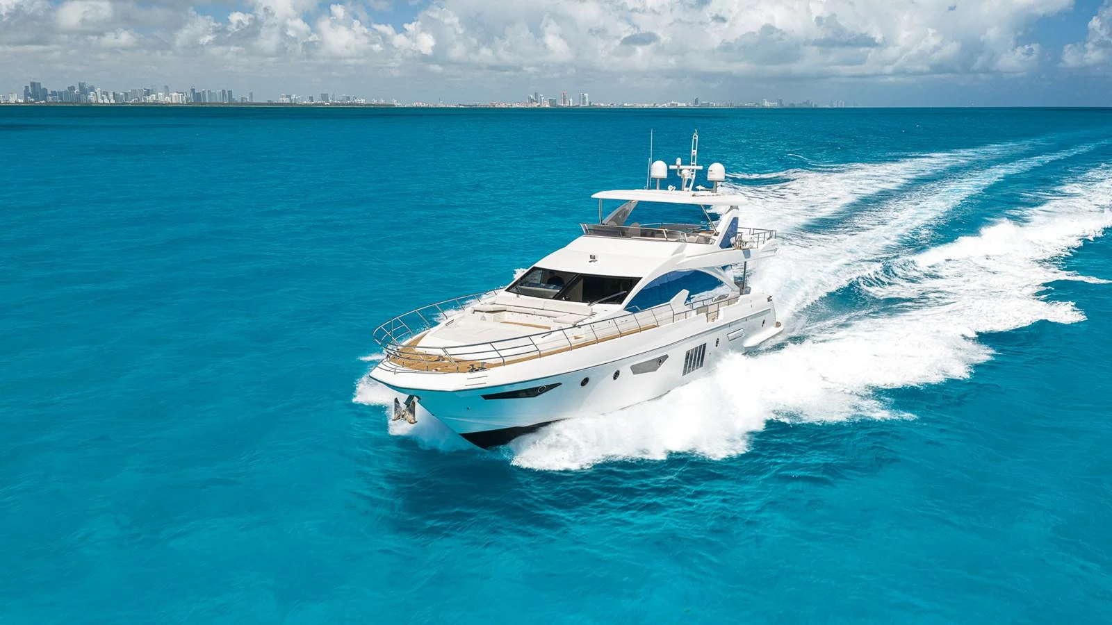 a white yacht on the water aboard SABI Yacht for Sale