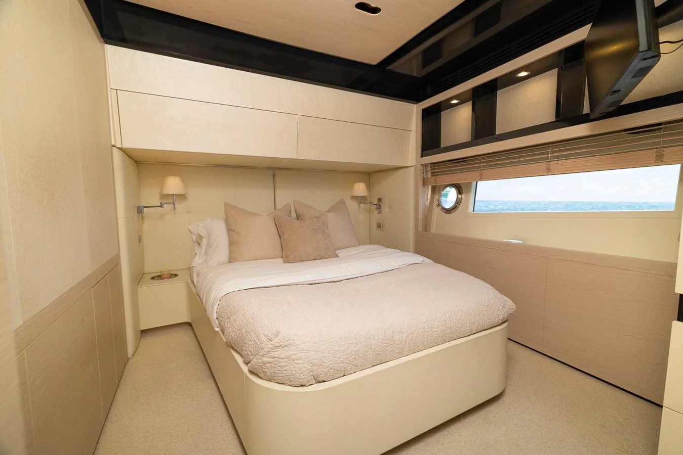 a room with a bed and a window aboard SABI Yacht for Sale