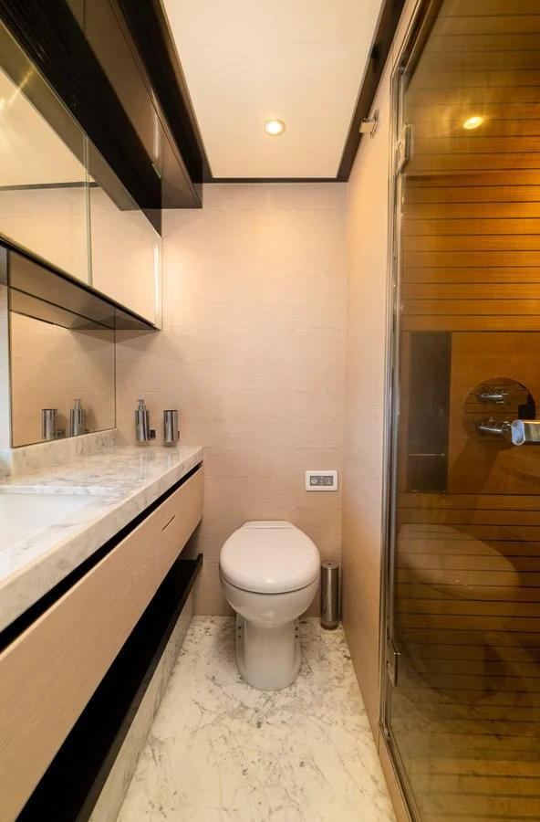 a bathroom with a glass shower door aboard SABI Yacht for Sale