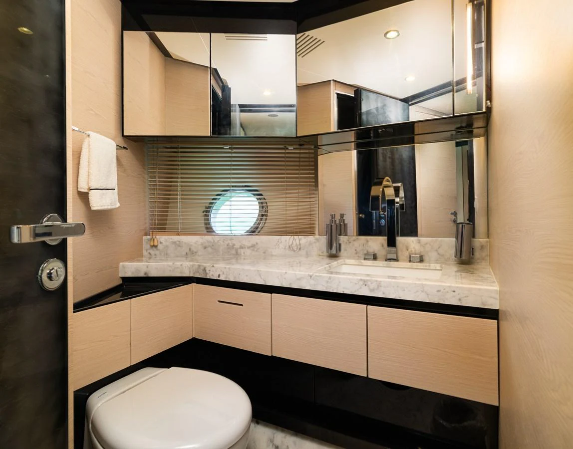 a bathroom with a large mirror aboard SABI Yacht for Sale