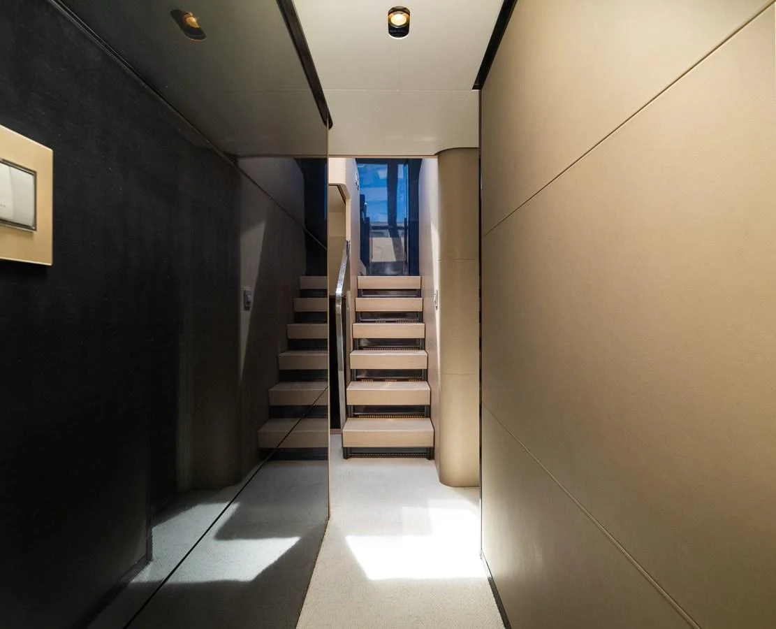 a hallway with a set of stairs aboard SABI Yacht for Sale
