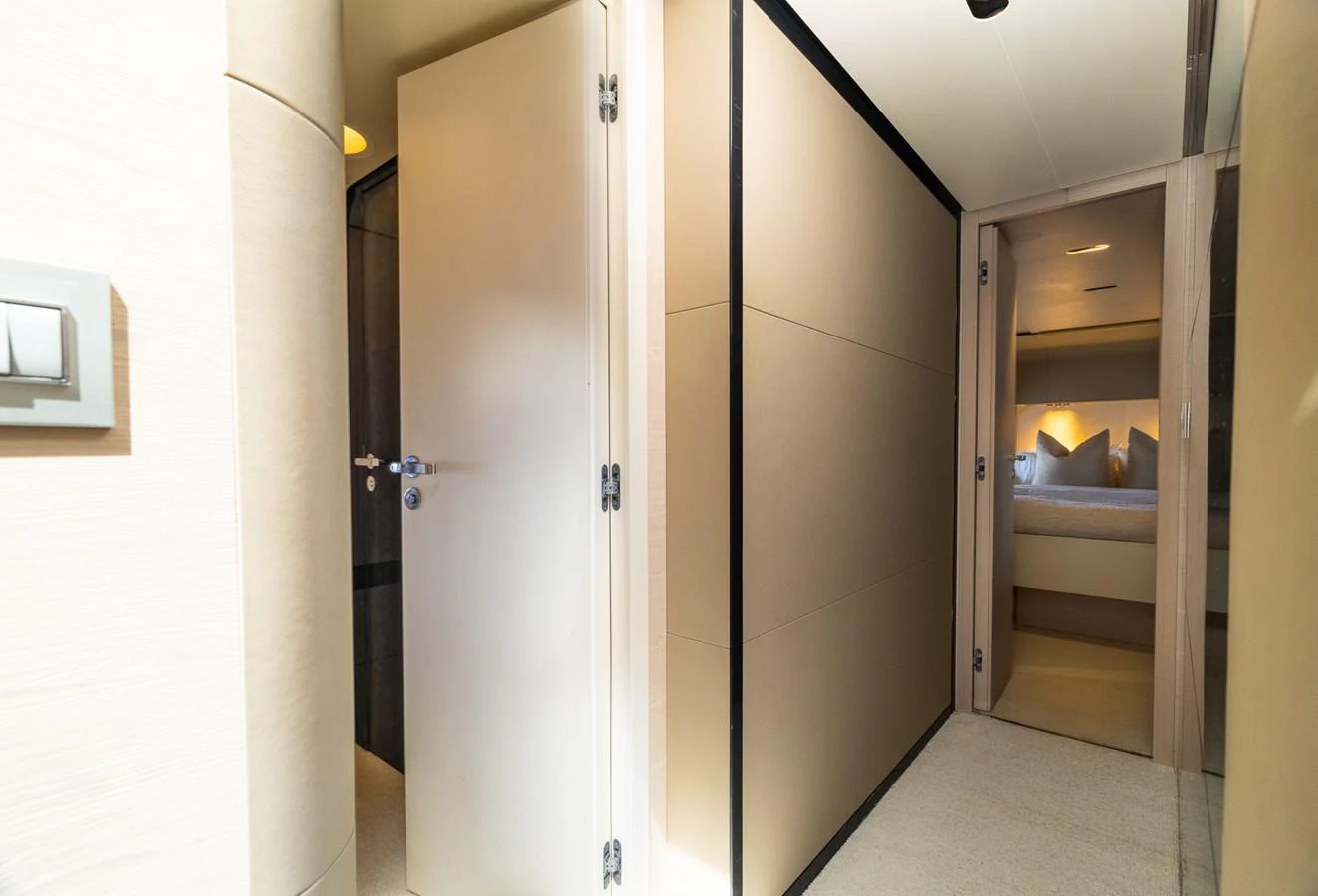 a room with a bed and a closet aboard SABI Yacht for Sale