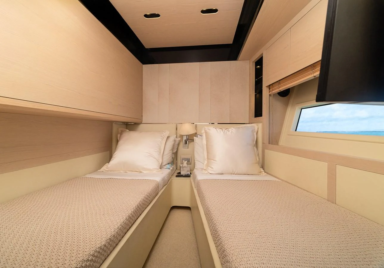 a room with two beds aboard SABI Yacht for Sale
