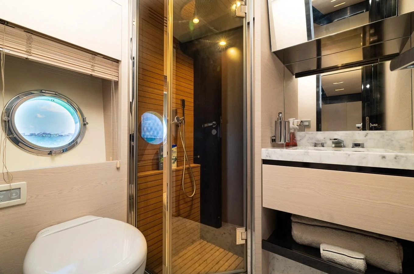 a bathroom with a toilet and a sink aboard SABI Yacht for Sale