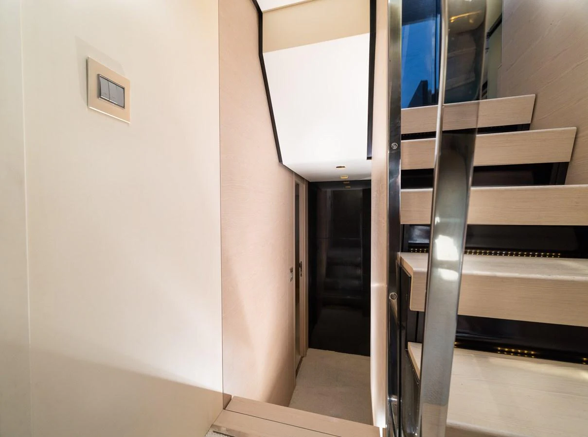 a set of stairs leading to a room aboard SABI Yacht for Sale