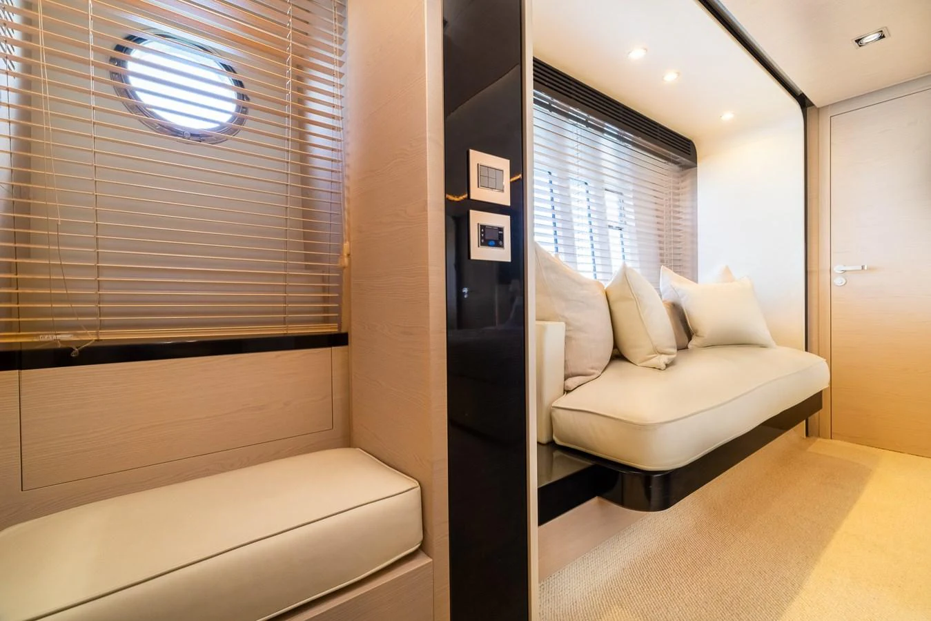 a room with a couch and a window aboard SABI Yacht for Sale