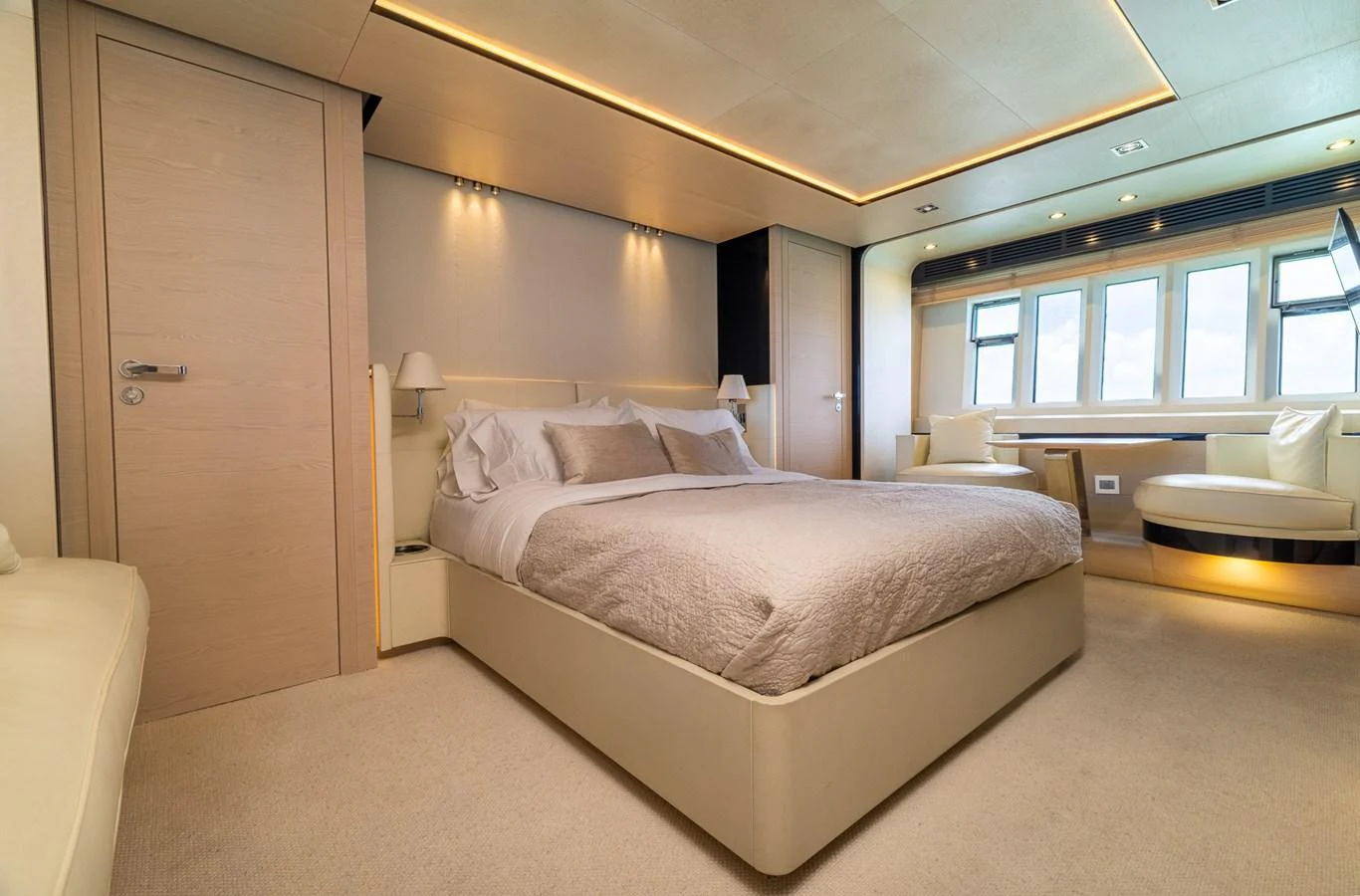 a room with a bed and a chair aboard SABI Yacht for Sale