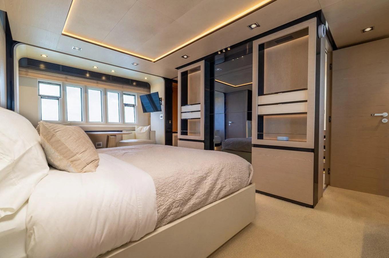 a room with a bed and a television aboard SABI Yacht for Sale