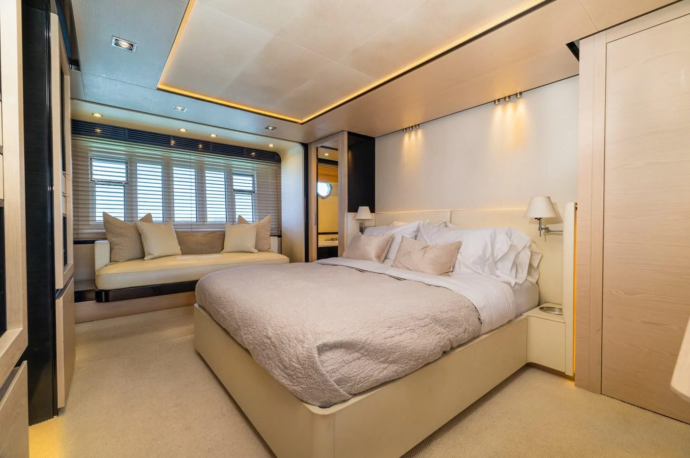 a room with a bed and a couch aboard SABI Yacht for Sale