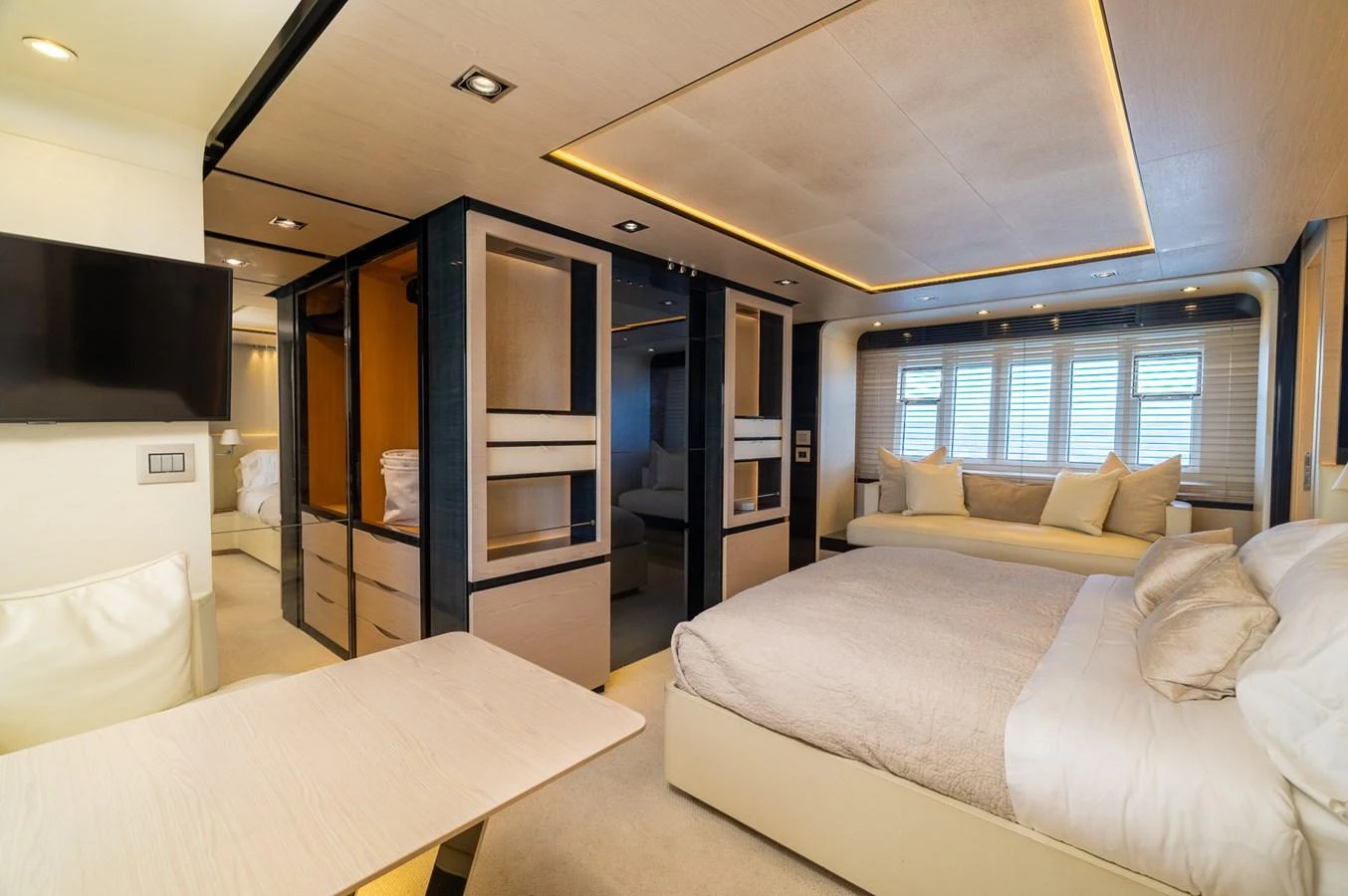 a room with a bed and a tv aboard SABI Yacht for Sale