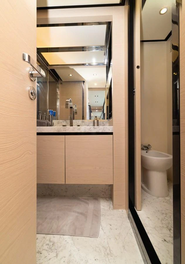 a bathroom with a large mirror aboard SABI Yacht for Sale
