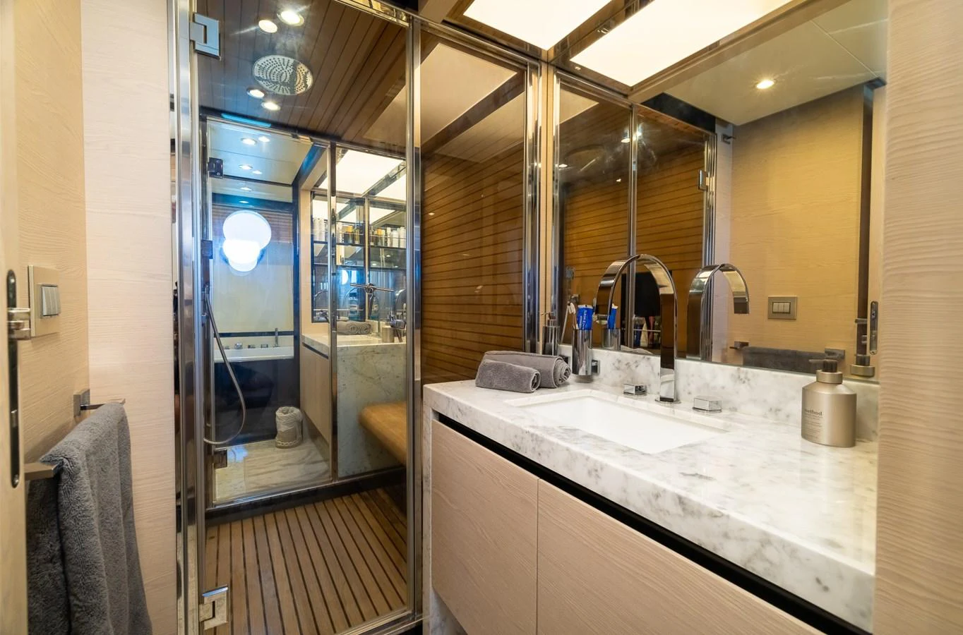 a bathroom with a large mirror aboard SABI Yacht for Sale