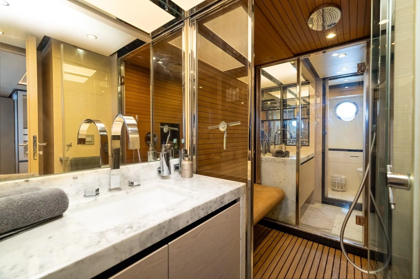 a bathroom with a sink and a mirror aboard SABI Yacht for Sale