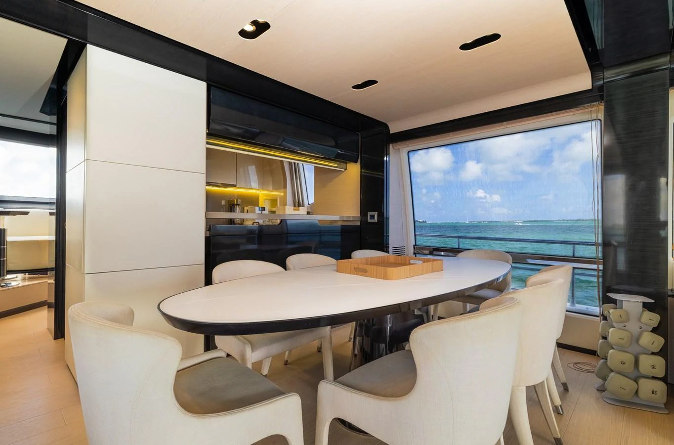 The yacht's dining area offers a modern and elegant space with a stunning ocean view. aboard SABI Yacht for Sale