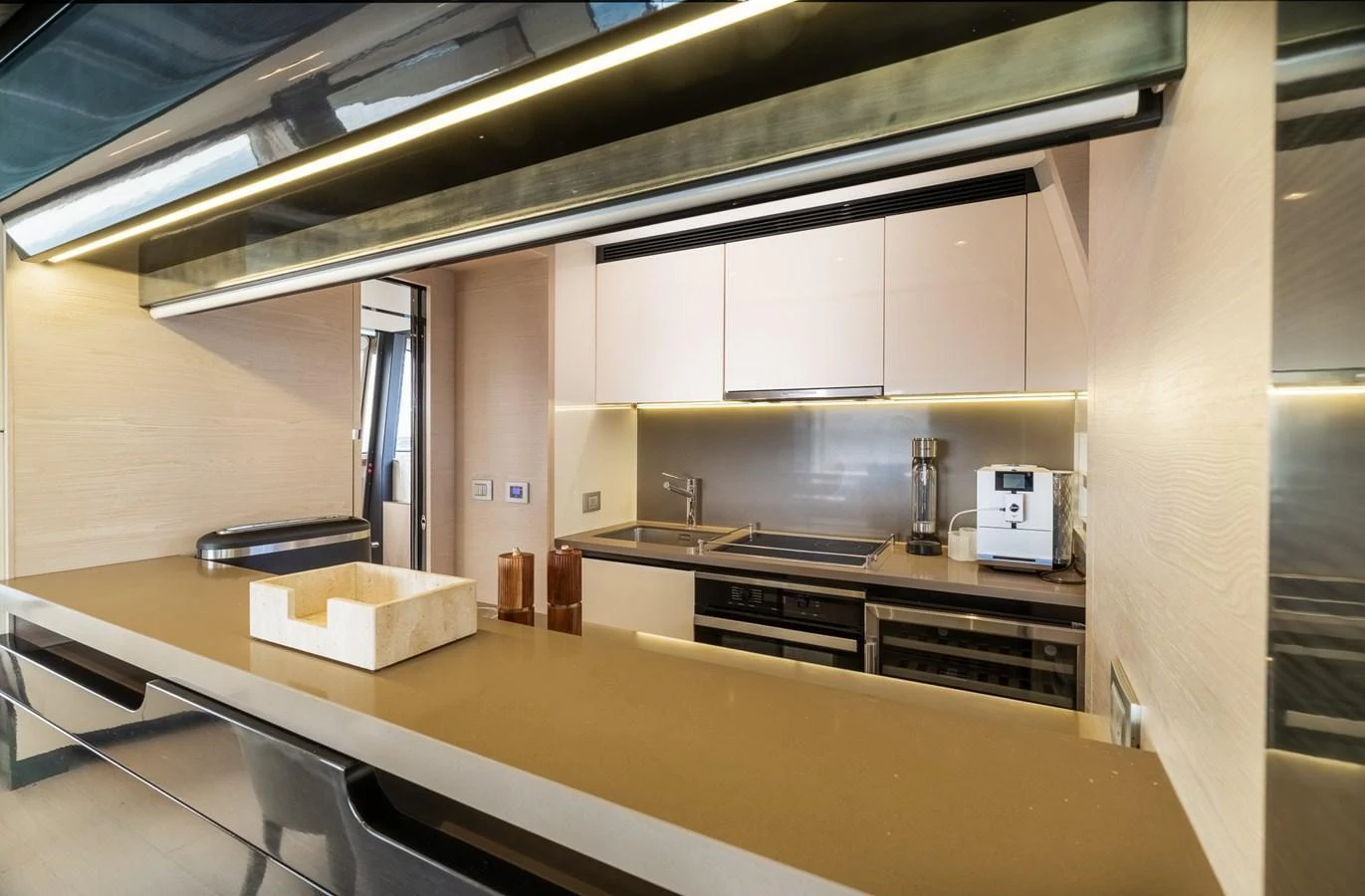 The yacht's galley features modern appliances and sleek design, perfect for gourmet cooking at sea. aboard SABI Yacht for Sale