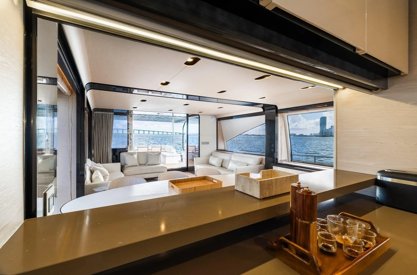 The salon offers a spacious and luxurious seating area with a stunning view of the water. aboard SABI Yacht for Sale