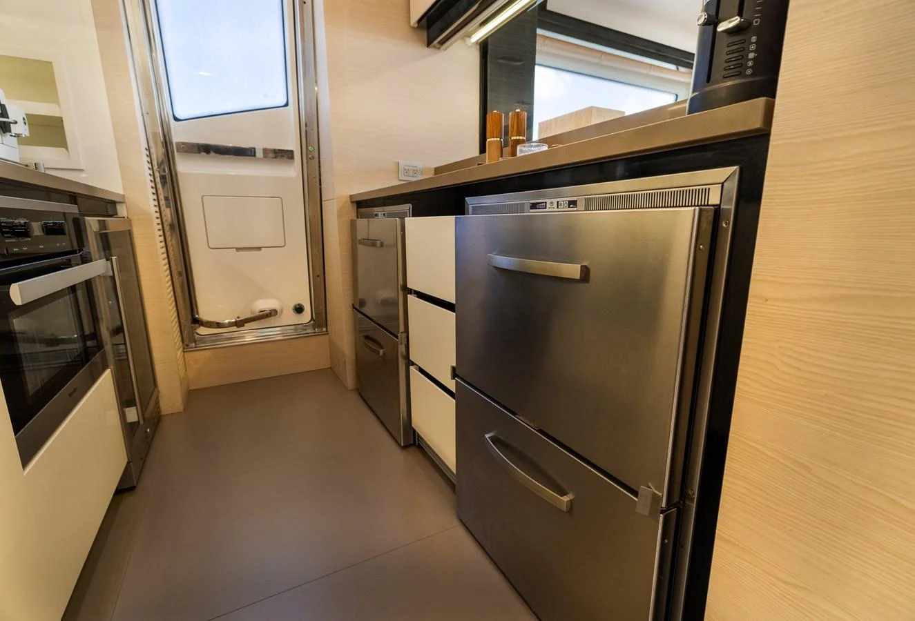 The yacht's galley features modern stainless steel appliances and ample storage space. aboard SABI Yacht for Sale