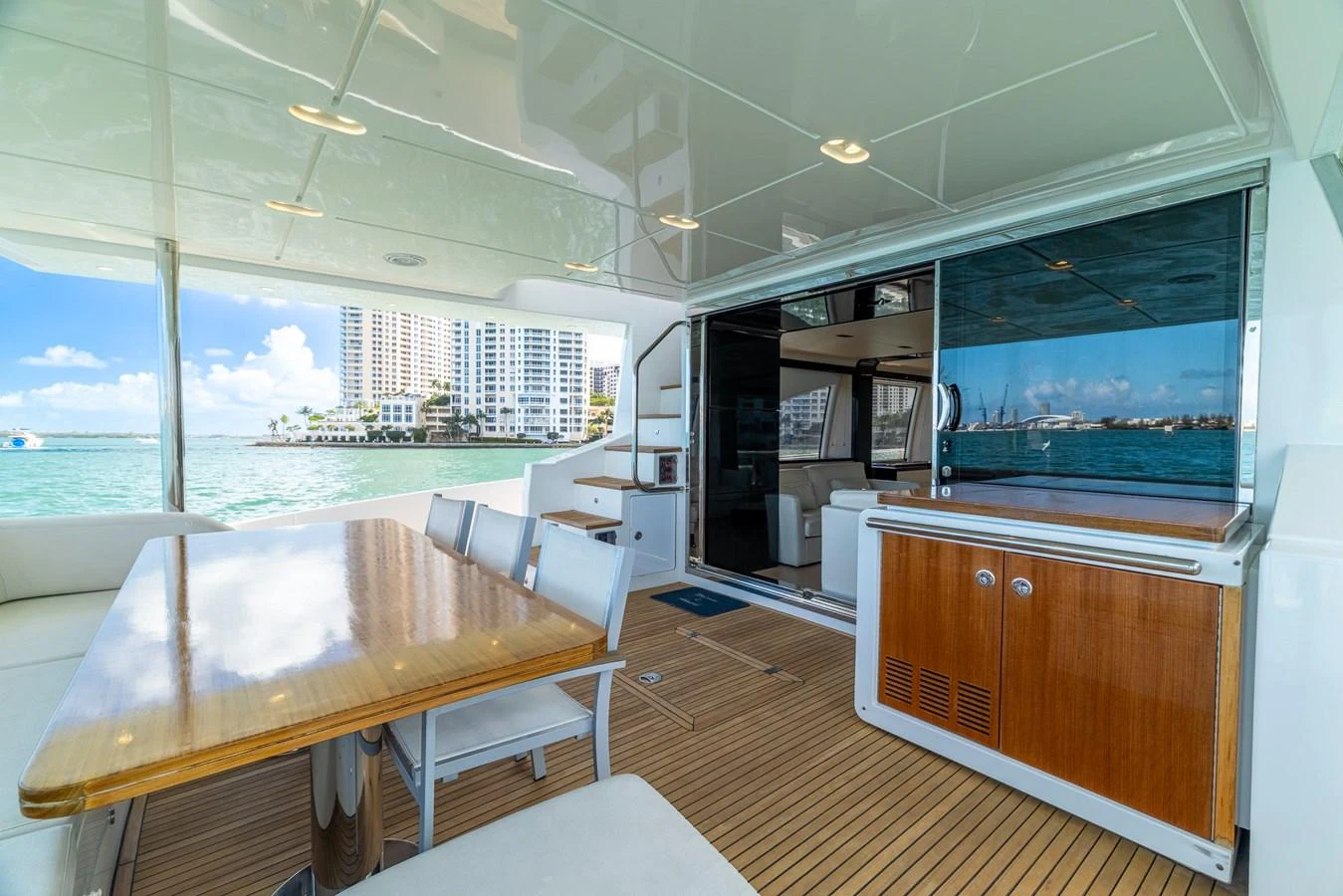 a room with a table and chairs aboard SABI Yacht for Sale