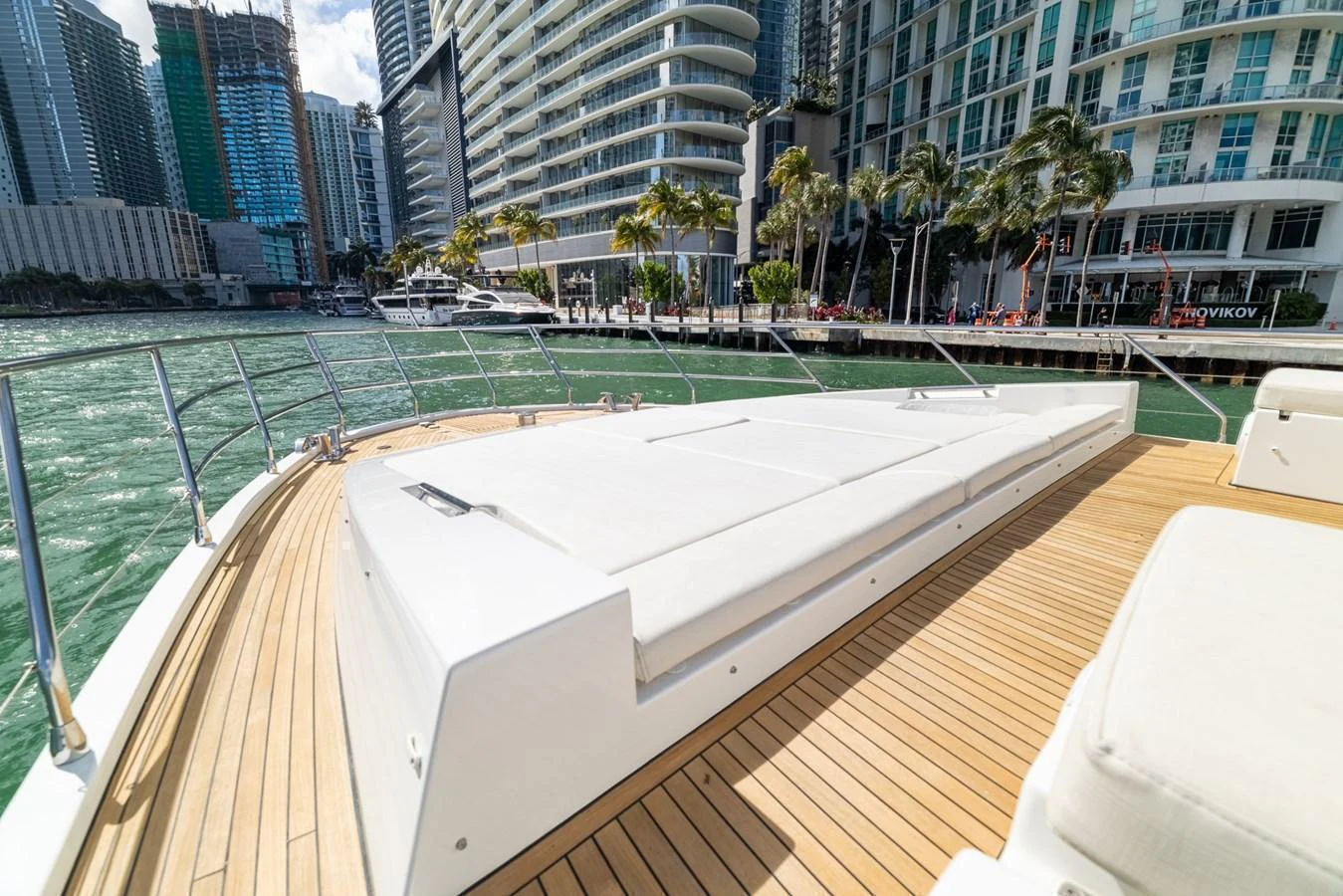 a pool with a city in the background aboard SABI Yacht for Sale
