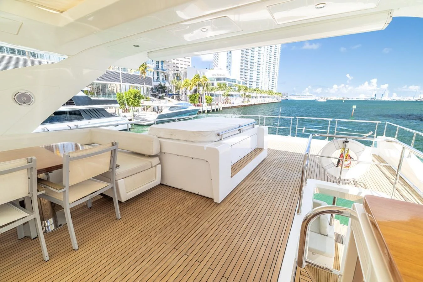 The aft deck offers a spacious and inviting area with comfortable seating and stunning views of the marina. aboard SABI Yacht for Sale