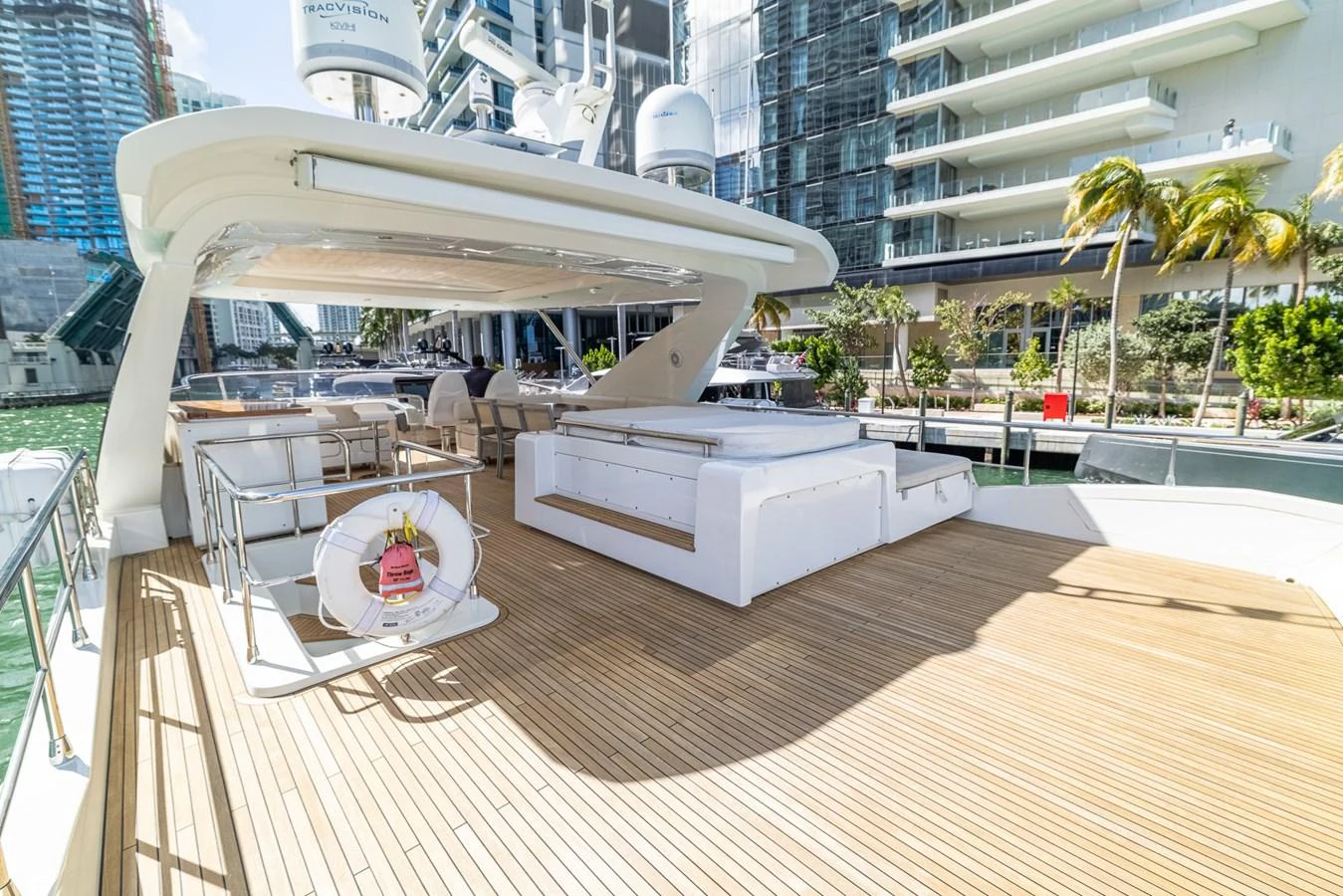 a deck with a table and chairs aboard SABI Yacht for Sale