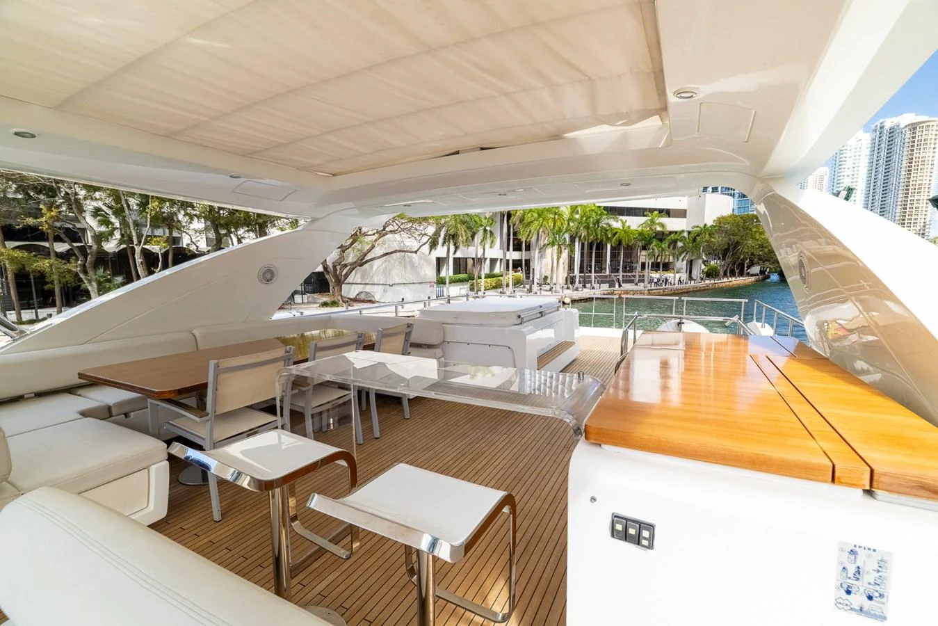 a room with tables and chairs aboard SABI Yacht for Sale