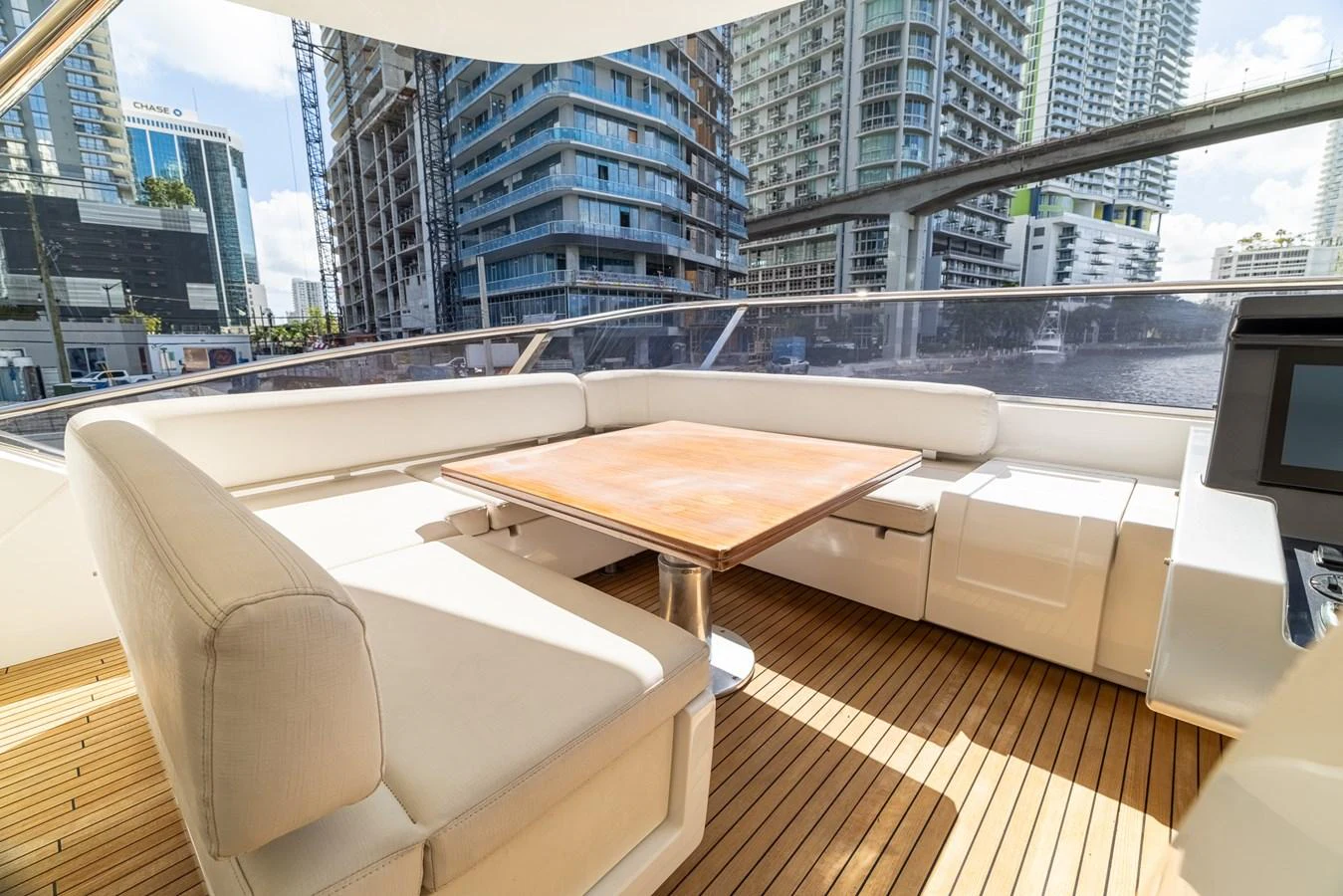 a table and chairs on a deck aboard SABI Yacht for Sale