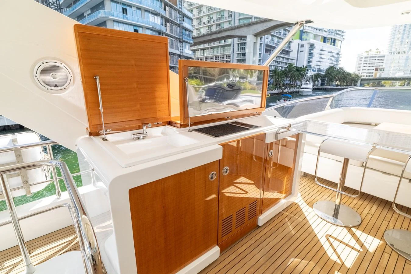 a room with a television and a table and chairs aboard SABI Yacht for Sale