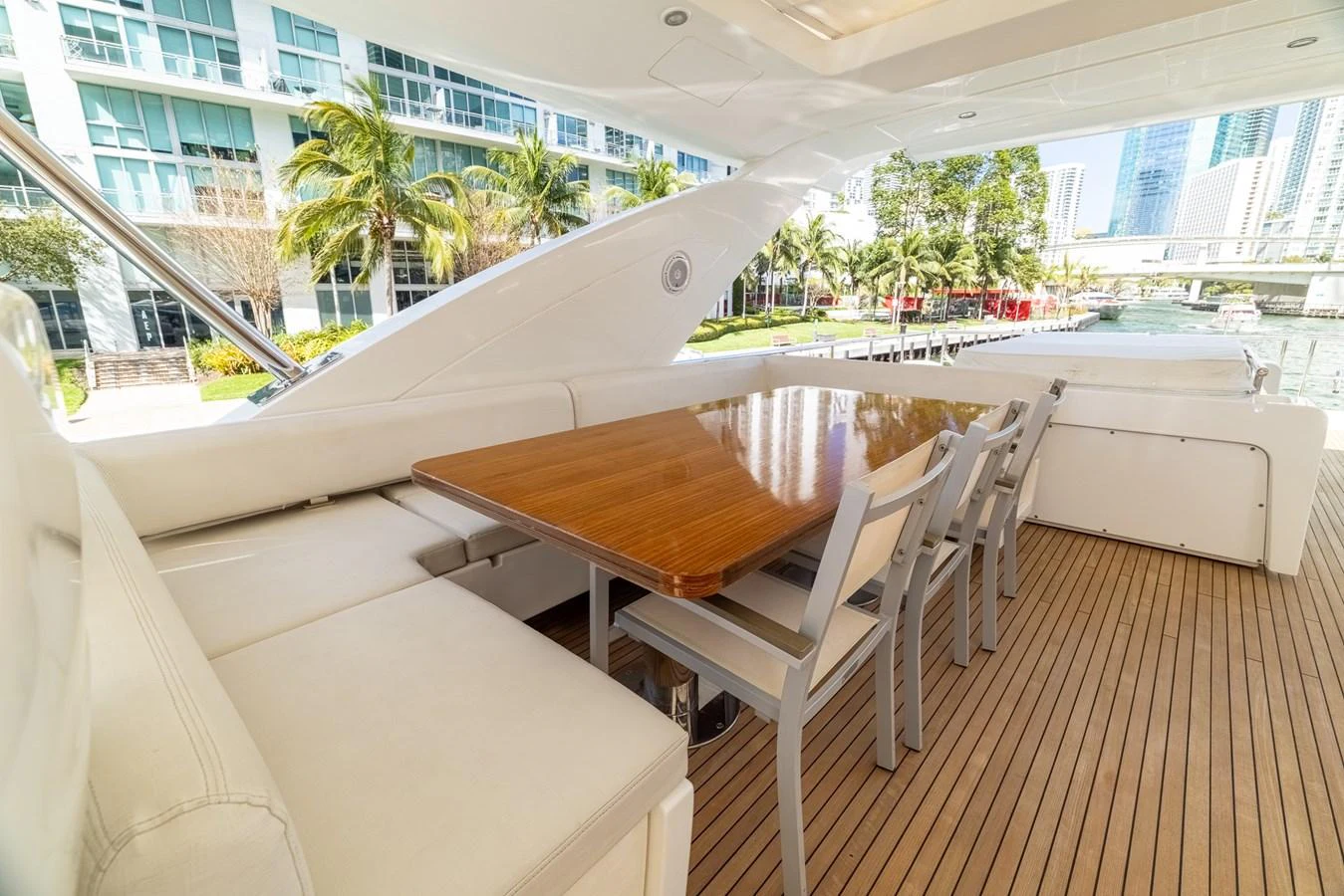 a room with a table and chairs aboard SABI Yacht for Sale