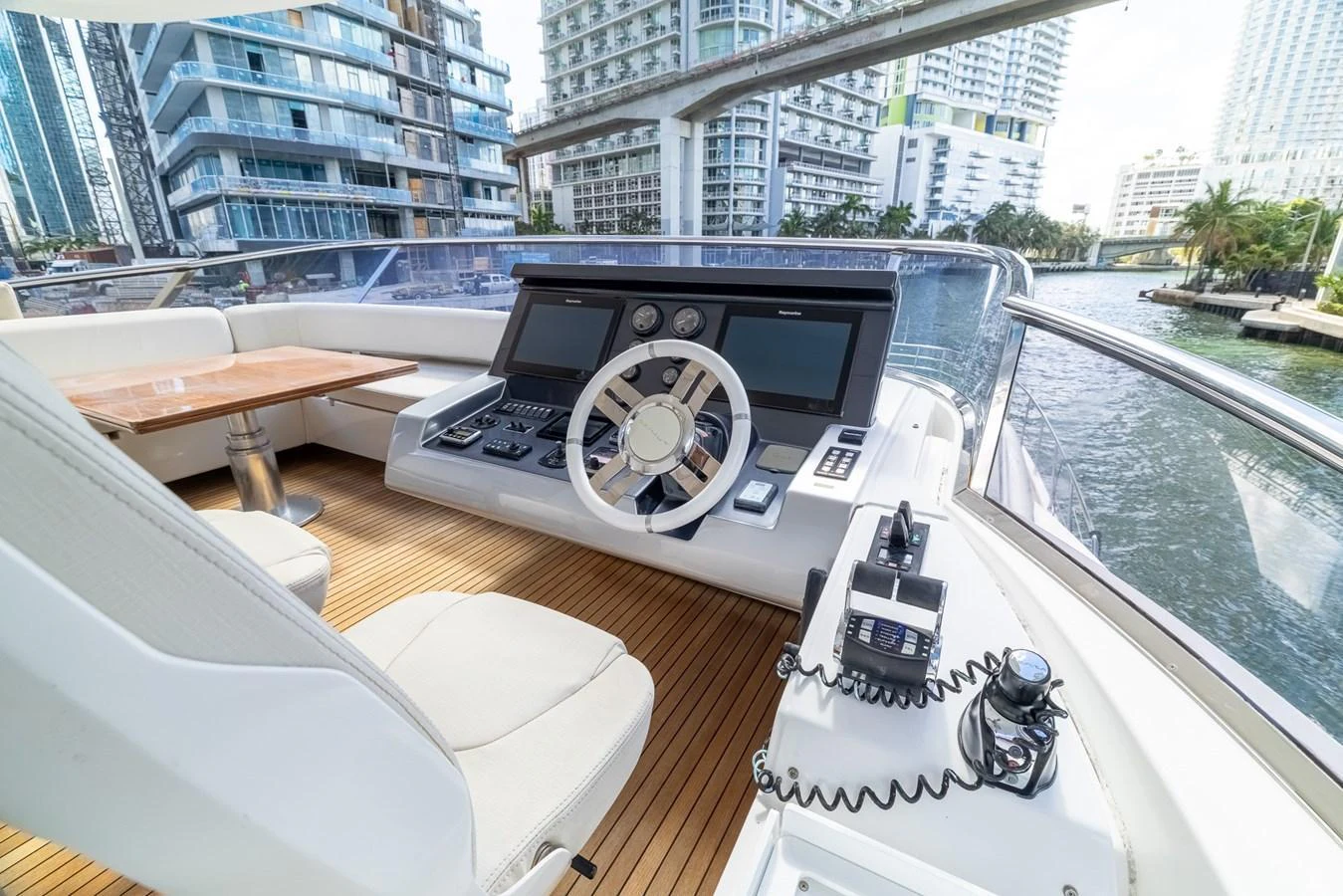 The helm station offers a modern and sleek design with advanced navigation equipment and a comfortable seating area. aboard SABI Yacht for Sale